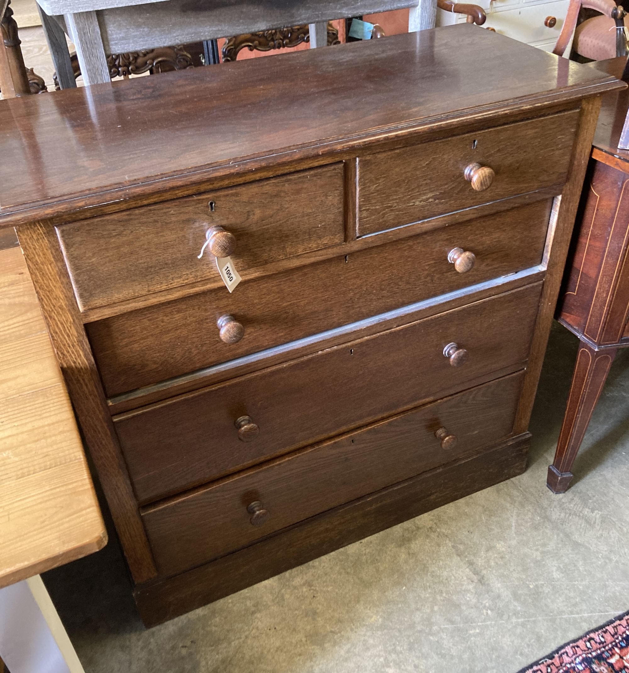 An early 20th century oak chest of drawers, width 106cm, depth 46cm, height 104cm